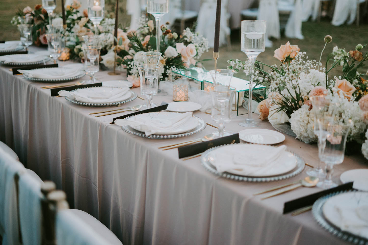 Decorated table setting at wedding celebration.